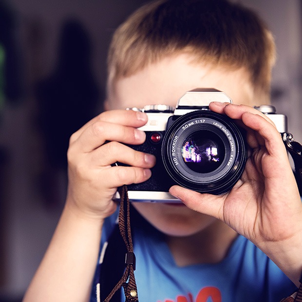 Young boy with camera