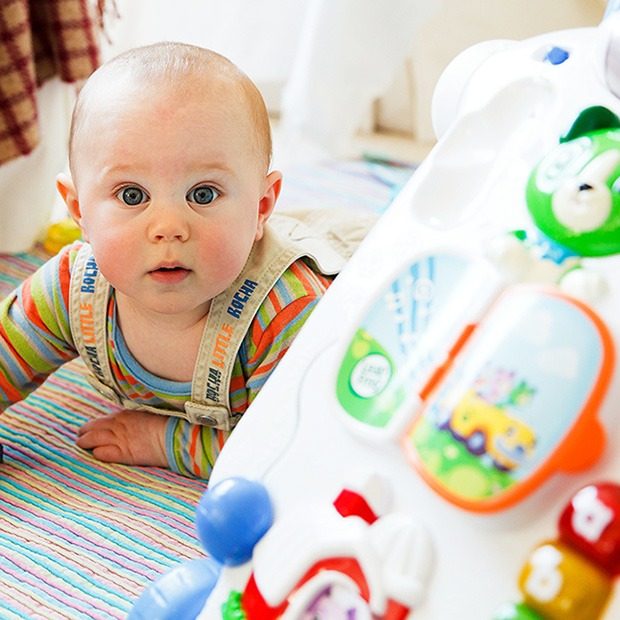 Young baby looking curiously at camera