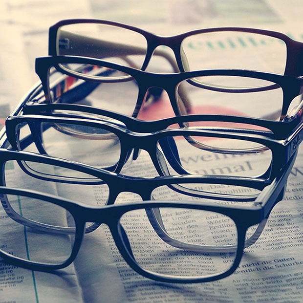 Various glasses frames stacked on each other