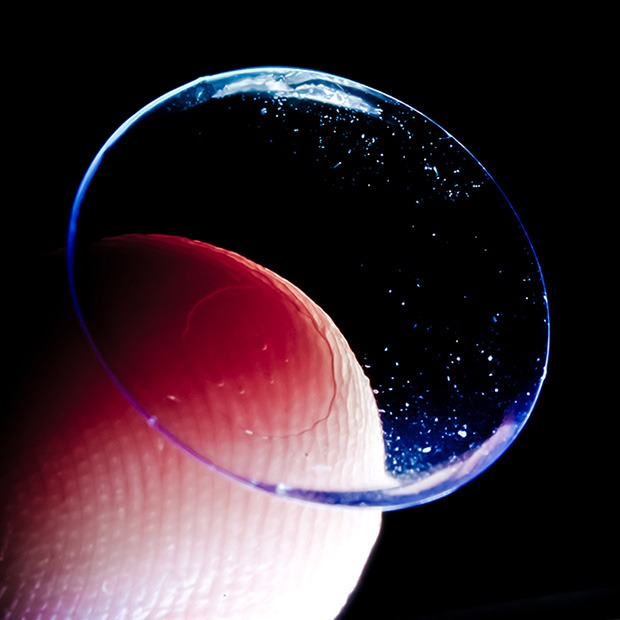 Closeup shot of contact lens on the tip of a finger