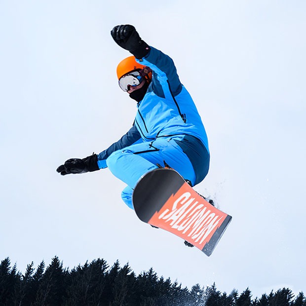 Picture of snowboarder performing a trick in the air